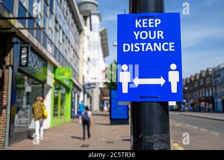 Bromley (Greater London), Kent, UK. Keep your distance sign on Bromley High Street during the coronavirus pandemic. Sign in focus, background blurred. Stock Photo