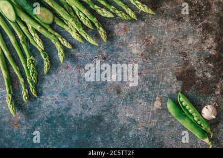 Group of green vegetables , flatlay on grey stone, copy space Stock Photo