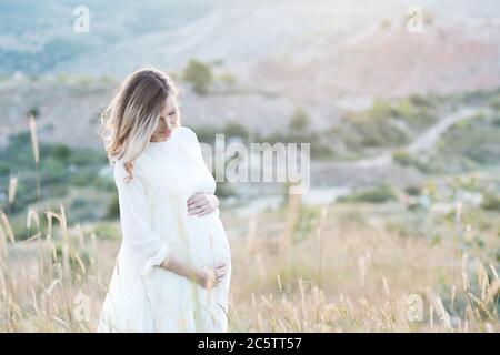 Close up of pregnant woman wearing pregnancy corset against