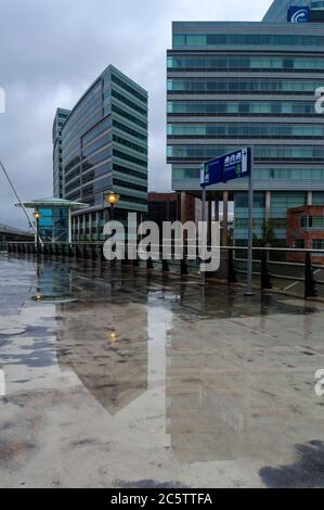 AMSTERDAM, THE NETHERLANDS JULY 4,2020: Boulevard of Amsterdam Sloterdijk Station reflections of two office buildings on the ground Stock Photo