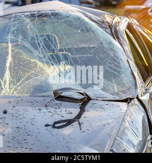 The broken car and a windshield.Broken glass Glass in the cracks. Car with broken glass after an accident. Stock Photo