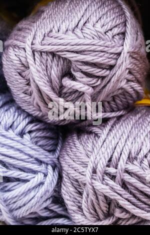 Background from multi-colored fluffy woolen threads for knitting closeup. Stock Photo