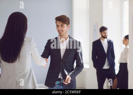 Handshake.Business people give a handshake at a meeting a successful contract in the office. Stock Photo