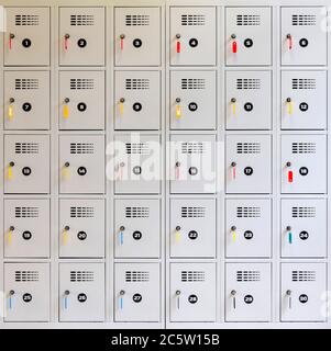 30 lockers with keys in the locks. Stock Photo