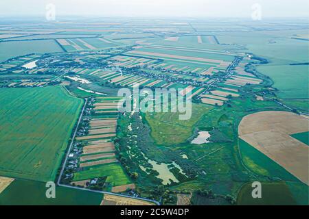 Top view of agricultural fields, land. Beautiful scenic countryside view at sunset Stock Photo