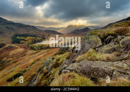 Dramatic View Of Blea Tarn From High Up With Storm Clouds On An Autumn Morning. Lake District, UK.
