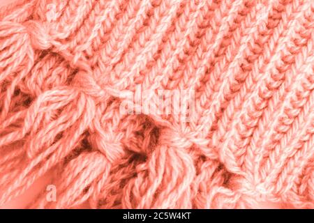 A fragment of a woolen scarf. The concept of care and warmth. Close-up. Stock Photo
