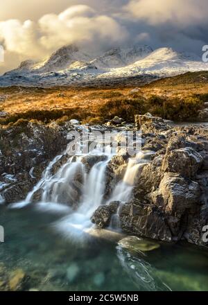 Breathtaking Winter view of the Cuillin mountain range covered in snow on the Isle of Skye, Scotland. Stock Photo