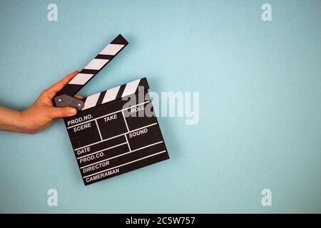 Movie clapper on blue background, cinema concept Stock Photo