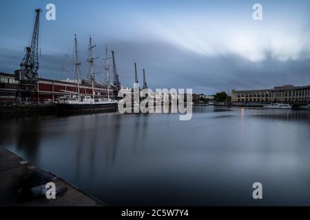 Historic boats including the tallship Lord Nelson are moored alongside the M Shed museum in Bristol's Floating Harbour. Stock Photo