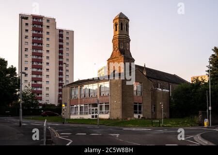 Evening light falls on the bell tower of St Luke's Church in the Barton Hill council estate area of Bristol. Stock Photo