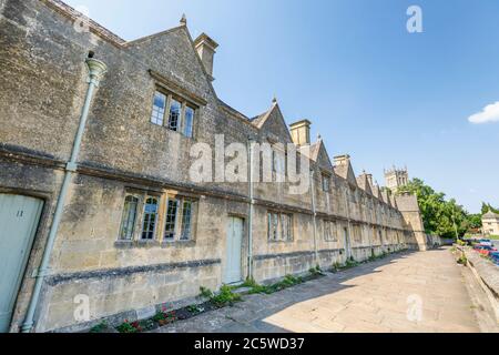 A row of historic terraced Grade 1 listed Almshouses in Church Street, Chipping Campden, a small market town in the Cotswolds in Gloucestershire Stock Photo