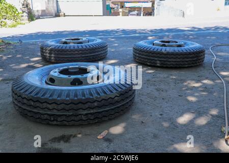New tires are going to change the car. new truck tires lie on the ground Stock Photo