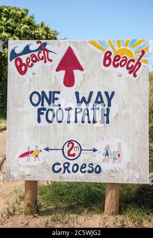 Llangennith Beach, Swansea, UK. 5th July, 2020. Beach one way system access signs at the entrance to Llangennith beach on the Gower Peninsula near Swansea as the lockdown in Wales continues. Credit: Phil Rees/Alamy Live News Stock Photo