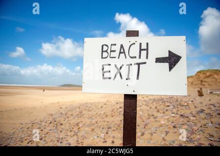 Llangennith Beach, Swansea, UK. 5th July, 2020. Beach one way system access signs at the entrance to Llangennith beach on the Gower Peninsula near Swansea as the lockdown in Wales continues. Credit: Phil Rees/Alamy Live News Stock Photo