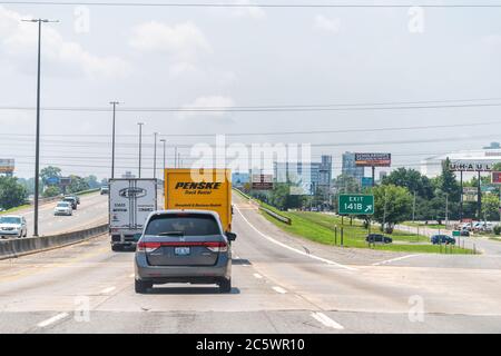 Little Rock, USA - June 4, 2019: Capital city in Arkansas with exit sign and cars trucks in traffic for relocation and billboards driving point of vie Stock Photo