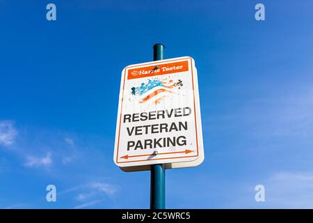 Warrenton, USA - June 9, 2020: Parking lot sign for veterans at Harris Teeter Kroger grocery store isolated against sky Stock Photo