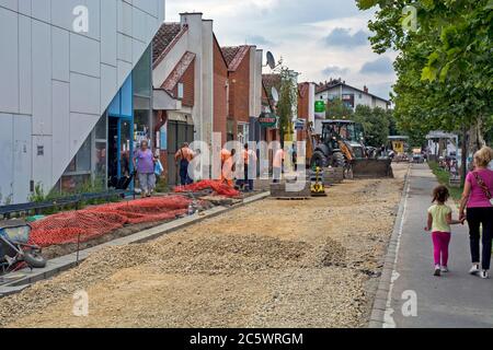 Zrenjanin, Serbia, July 04, 2020. Works on the installation of a new sidewalk in the settlement of Bagljas in the town of Zrenjanin. Works are current Stock Photo