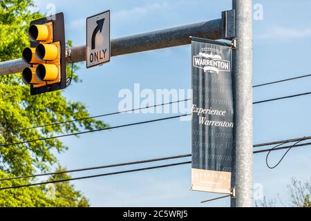 Warrenton, USA - June 9, 2020: Sign banner in Fauquier county city in Virginia with nobody and traffic light Stock Photo