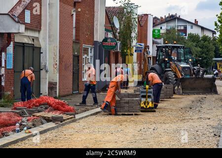 Zrenjanin, Serbia, July 04, 2020. Works on the installation of a new sidewalk in the settlement of Bagljas in the town of Zrenjanin. Works are current Stock Photo