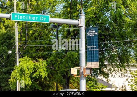 Warrenton, USA - June 9, 2020: Sign banner for tourism in Fauquier county city in Virginia with nobody and pedestrian traffic light Stock Photo