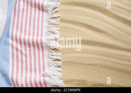 Beach towel on sand background Stock Photo