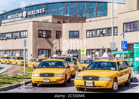 New York City,NYC NY Queens,LaGuardia Airport,LGA,ground transportation,American Airlines terminal exterior,taxi stand,yellow cab,cabs,car,vehicle,NY1 Stock Photo