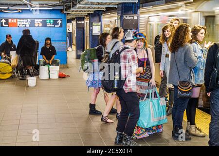 New York,New York City,NYC,Lower,Manhattan,MTA,subway,train,franchise,mass transport,Fulton Street Station,waiting platform,passenger passengers rider Stock Photo