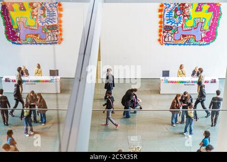 New York,New York City,NYC,Midtown,Manhattan,53rd Street,The Museum of Modern Art,MoMA,exhibit exhibition collection,information,desk,help,lobby,woman Stock Photo