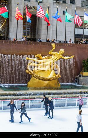 New York City,NYC NY Midtown,Manhattan,5th Fifth Avenue,Rockefeller Center,Plaza,fountain,Prometheus,gilded statue,Paul Manship,sculptor,ice skating r Stock Photo