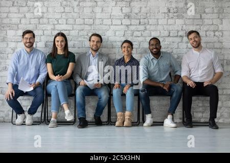 Multiethnic people applicants wait for job interview feels confident Stock Photo