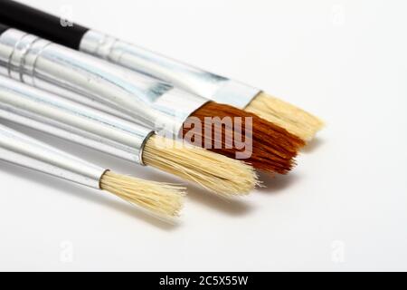 selection of artists bristle paint brushes isolated on white Stock Photo