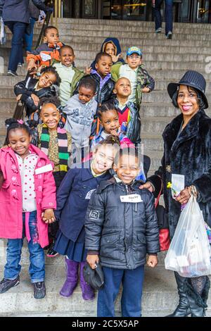 New York City,NYC NY Manhattan,Uptown,Central Park West,American Museum of Natural History,Black woman female women adult adults,boy boys,male kid kid Stock Photo