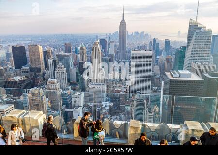 New York City,NYC NY Manhattan,Rockefeller Center Top of the Rock Observation Deck,city skyline skyscrapers south view Empire State building visitors Stock Photo