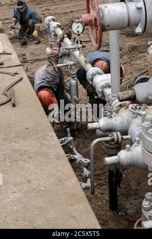 Removing the wellhead equipment at the gas well before overhaul Stock Photo