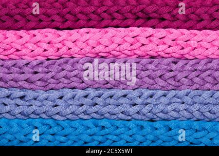 Macro horizontal rows of multicolor woven braids Stock Photo