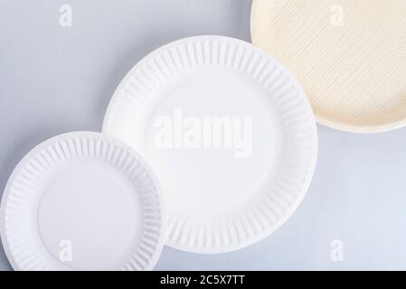 Disposable plates lined up diagonally on a photo Stock Photo