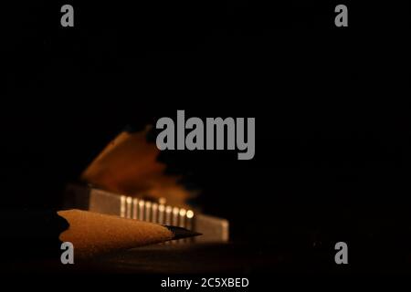 pencil tip on a black background with sharpener detail Stock Photo