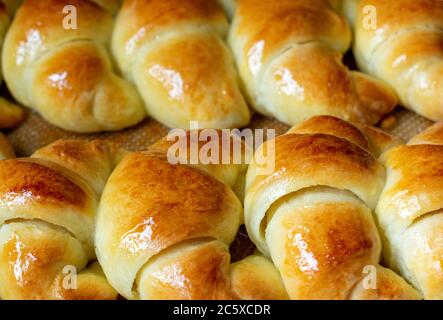 Argentine croissants, medialunas de Manteca over silicon pastry mat Stock Photo