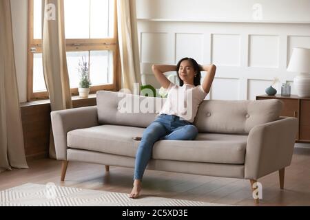 Serene young vietnamese woman resting with closed eyes. Stock Photo