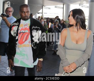 LOS ANGELES, CA - JUNE 12: Kim Kardashian and husband Kanye West are seen at Los Angeles International Airport (LAX) on June 12, 2016 in Los Angeles, California  People:  Kim Kardashian, Kanye West Stock Photo