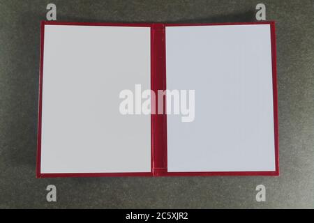 Opened book cover on a dark background close-up. Stock Photo