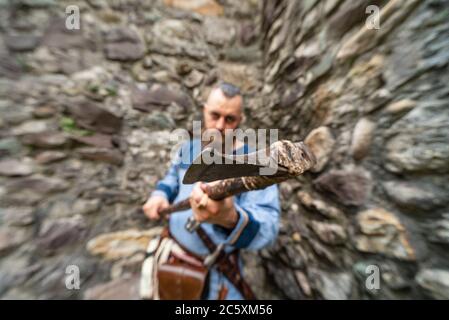 Close up of the ax wielded by a Viking warrior, image with blurred background Stock Photo