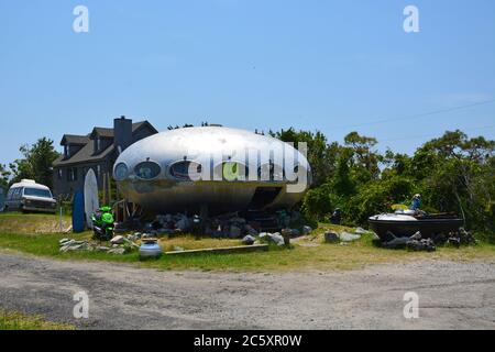 The Futuro Home located in the Town of Frisco on the Outer Banks of North Carolina before it burned down in October of 2022. Stock Photo