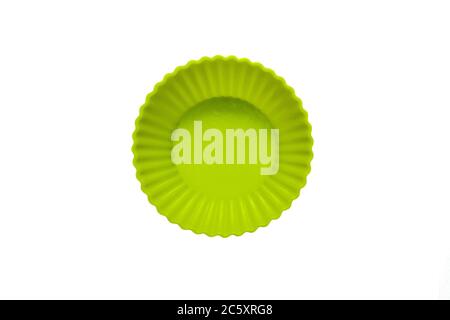 Green silicone cupcake baking dish isolated on white background Stock Photo