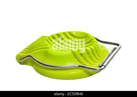 Green egg slicer isolated on white background Stock Photo