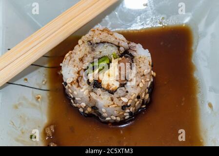 Japanese sushi food is excellent. Maki and rolls with tuna, salmon and avocado. Top view of sushi roll. wasabi.Selective focus. Stock Photo