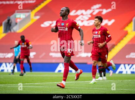 Liverpool. 6th July, 2020. Liverpool's Sadio Mane (C) celebrates scoring a goal during the Premier League match between Liverpool and Aston Villa at Anfield in Liverpool, Britain on July 5, 2020.FOR EDITORIAL USE ONLY. NOT FOR SALE FOR MARKETING OR ADVERTISING CAMPAIGNS. NO USE WITH UNAUTHORIZED AUDIO, VIDEO, DATA, FIXTURE LISTS, CLUB/LEAGUE LOGOS OR 'LIVE' SERVICES. ONLINE IN-MATCH USE LIMITED TO 45 IMAGES, NO VIDEO EMULATION. NO USE IN BETTING, GAMES OR SINGLE CLUB/LEAGUE/PLAYER PUBLICATIONS. Credit: Xinhua/Alamy Live News
