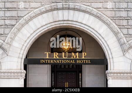Sign on the building facade at the entrance of the Trump International Hotel in Washington. Formerly the Old Post Office and Clock Tower building. Stock Photo