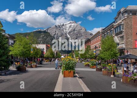 View of  Banff Avenue in summer. Banff is the main town inside Banff National Park and a centre of tourism in the area Stock Photo